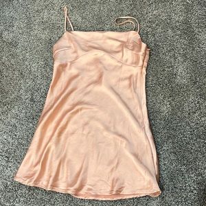 Princess Polly light orange mini dress, silky material, tight and flow at bottom